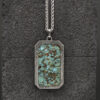 Turquoise Glow Stone Damascus pendant